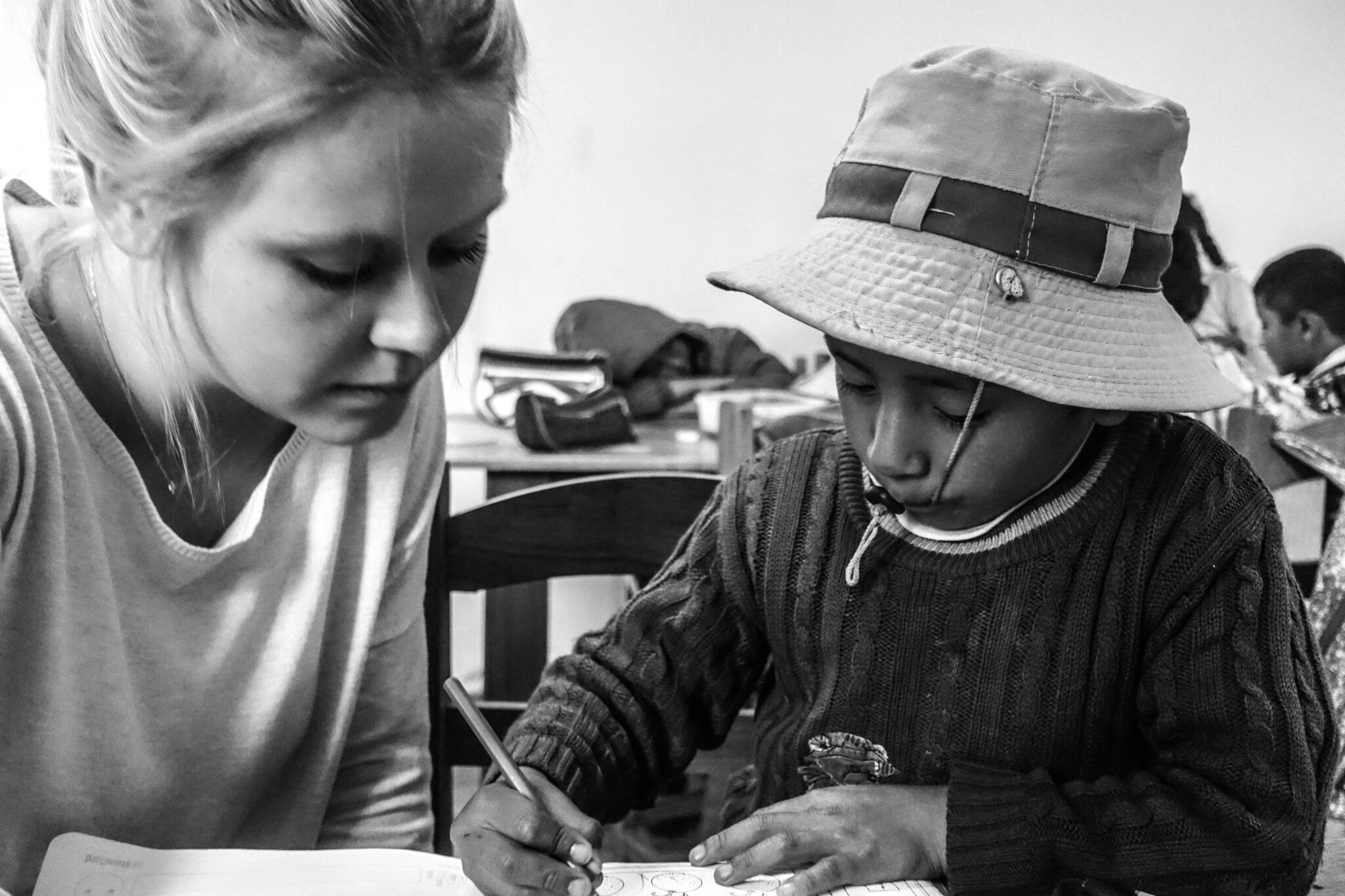 Teacher helping a child at school